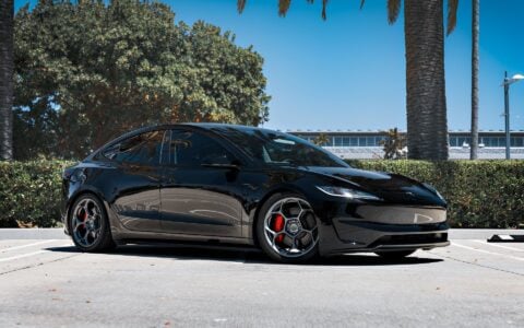 Close-up of 19-inch Satin Titanium UP-05 Forged Wheels by Unplugged Performance on a 2024 Tesla Model 3 Performance, highlighting the detailed design and red brake calipers.