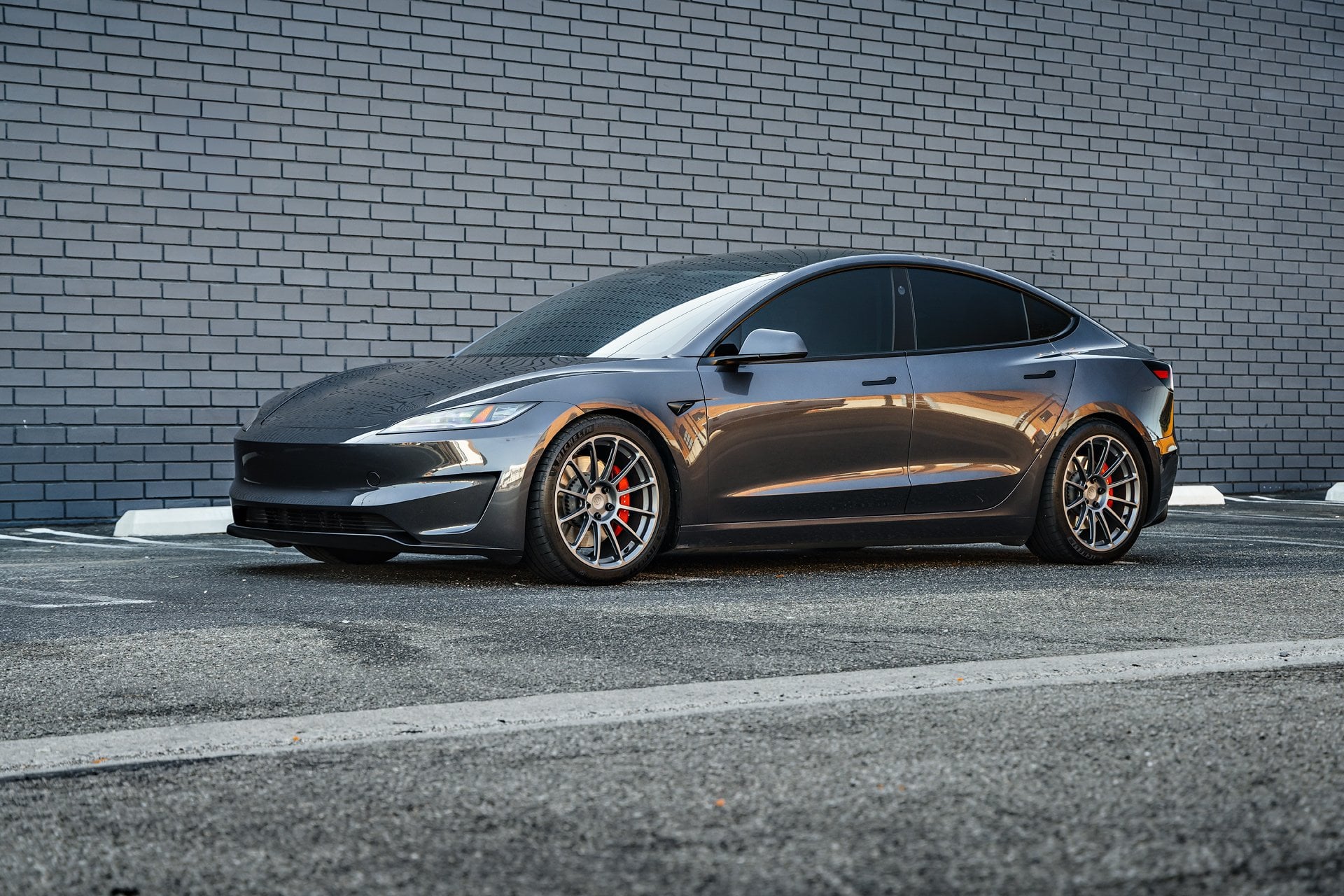 2024 Stealth Grey Tesla Model 3 Performance with Moderate Lowering Springs on 19 inch UP-03 Forged Wheels in Satin Titanium