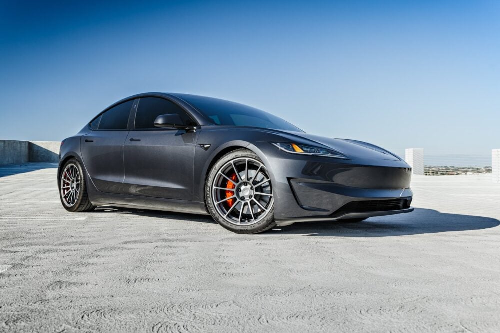 2024 Stealth Grey Tesla Model 3 Performance with Moderate Lowering Springs on 19 inch UP-03 Forged Wheels in Satin Titanium