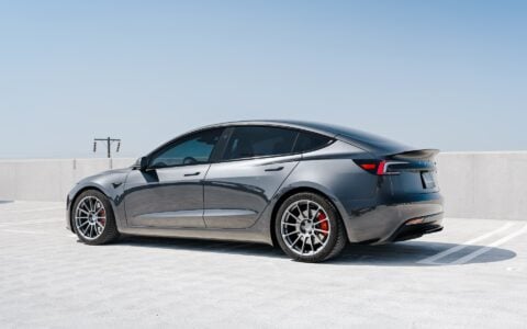 Stealth Grey 2024 Tesla Model 3 Performance with OEM Suspension on 19 Inch UP-03 Forged Wheels in Satin Titanium