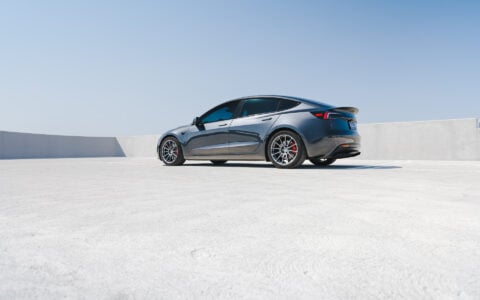 Stealth Grey 2024 Tesla Model 3 Performance with OEM Suspension on 19 Inch UP-03 Forged Wheels in Satin Titanium