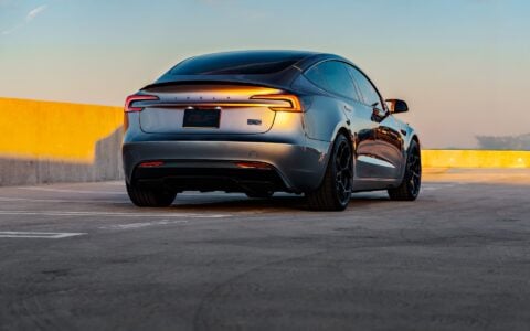 A Quicksilver Tesla Model 3 Performance parked with UP-05 Forged Wheels.