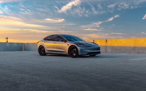 Quicksilver Tesla Model 3 Performance parked with UP-05 Forged Wheels during sunset.