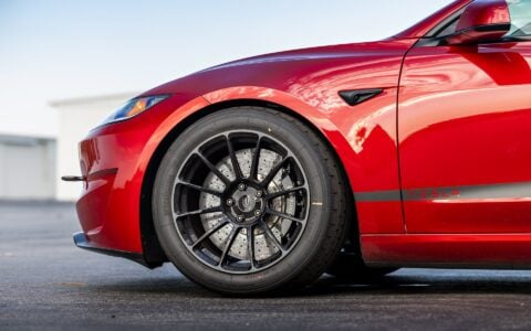 Tesla Model 3 Performance front shot featuring UP-03 Gloss Black Forged Wheels by Unplugged Performance, enhancing both style and function.