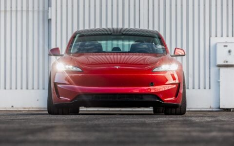 Front Bumper Video f a Tesla Model 3 Performance featuring UP-03 Gloss Black Forged Wheels by Unplugged Performance in the perfect stance parked on a tarmac.