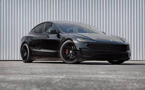 Tesla Model 3 Performance parked outdoors featuring UP X BBS Flugplatz Wheels in Gloss Black by Unplugged Performance with Yokohama Advan Apex tires.